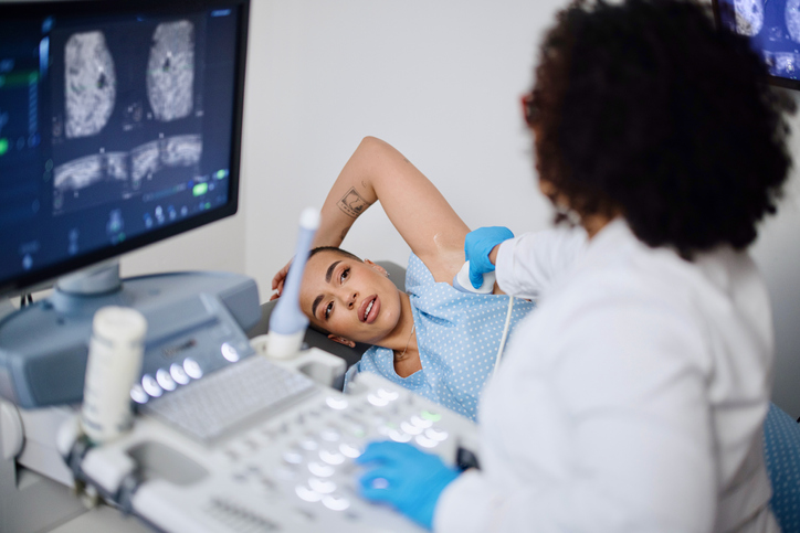 A woman getting an ultrasound on her breast